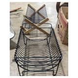 Two metal log racks, one collapsible ~18x14