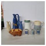 Piggy bank, small shot steins, and assorted
