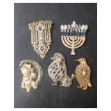 5  gold tone brooches  bear ,candles ,dog