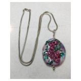 Floral glass pendant on silvertone chain unmarked