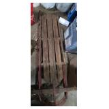 2 wooden metal frame snow sleds