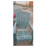 Two matching green outdoor chairs