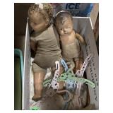 Old baby dolls and hangers