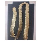 Elastic gold colored coin belt