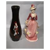 8' black vase decorated with a figure in