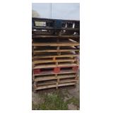 Stack of 12 wooden pallets
