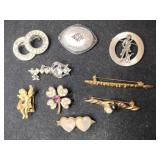 Different styles gold and silver tone brooches