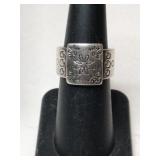 Silver flower band ring marked 925 size 6.