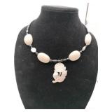 white/ black beaded choker necklace w/  carved