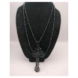 Ornate black beaded cross necklace