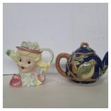 Porcelain girls head  and pottery bird teapots