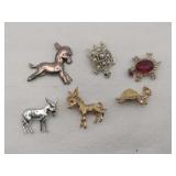 Donkey and turtle brooches