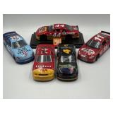 Autographed 1:24 diecast NASCAR race cars 4, 11,