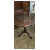 Claw footed pie crust top round table with glass