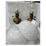 2 hurricane lamps with white glass shades