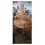 Oval pedestal base oak finish dinning table with