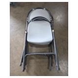 3 plastic folding chairs