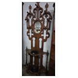 Oval mirrored hall tree with coat hooks