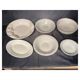 Embossed white ceramic bowls, smaller bowl and