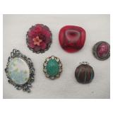 Round colorful brooches