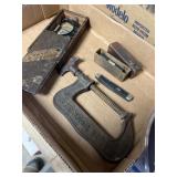 Micrometer, bubble level, pocket knife, and C