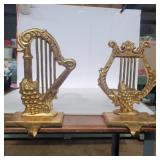 Metal gold colored musical stocking holder 11in