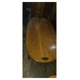 Oak oval top coffee table 48x26x16in