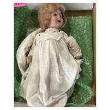Very old bisque doll and gown