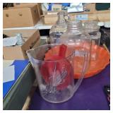 2 glass jars, 1 lidded glass jar, 2 orange trays,