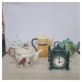 3 teapots, 1 teapot candle holder, and 1 clock