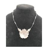 Black / white beaded hand carved flower pendant