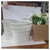 3 wicker waste baskets and faux lily flowers