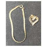 1/20 10k gold filled  bracelet ,pendant.   .165oz