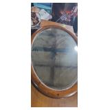 Oval wood framed mirror 33x24in