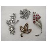 Clear and red rhinestone brooches