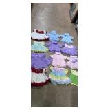 12 - multi colored and styles crocheted baby