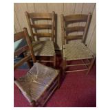 Three wooden chairs with wicker seats