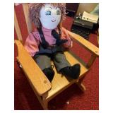 Small wooden rocking chair with handmade boy,