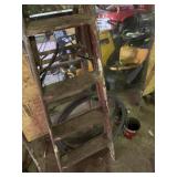 5 foot ladder and spool of fencing wire with