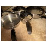 Stainless steel pots in skillets