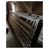 Three sections of metal framed barnyard railing,