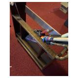Wooden entryway rack with umbrellas, canes, and