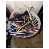 Basket of plastic hangers, and wire hangers