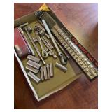 Various sockets and ratchets and 3 inch inch tri