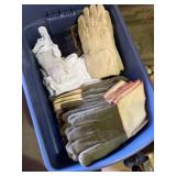 Tote full of working and welding gloves