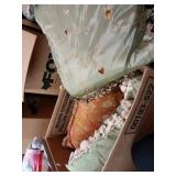 Large decorative pillow two in green and one in a