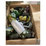 Collection of indoor and outdoor frog statues and