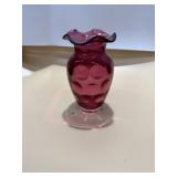 Fenton Art Glass cranberry ruffled vase with a