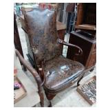 Vinyl wing back chair right arm rest broken. Arm
