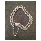 Silver chain bracelet w/ safety chain marked